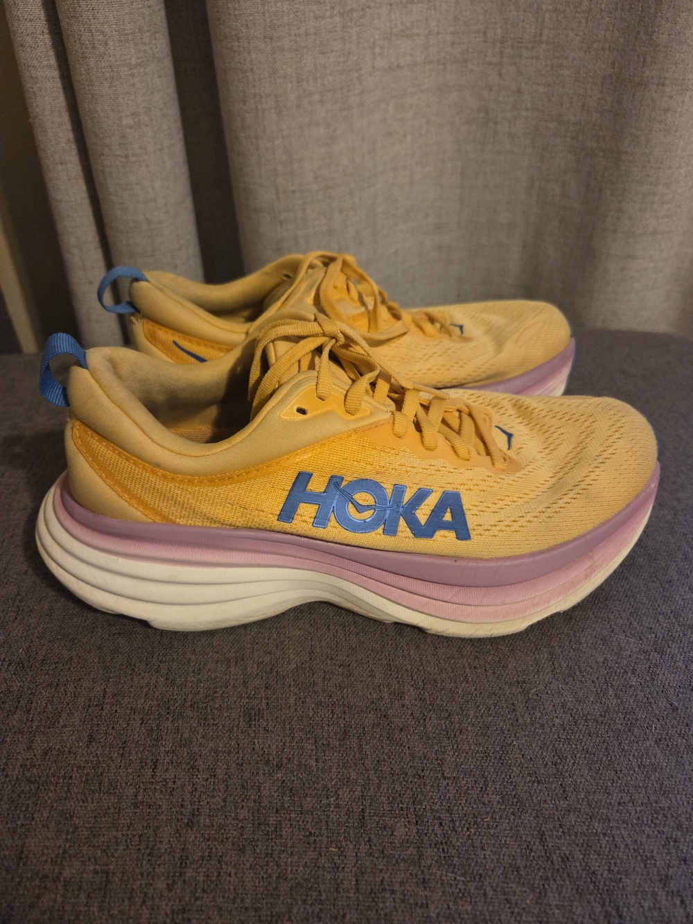 Hoka Women’s Yellow Running Shoes with Blue Logo and Pink Midsole